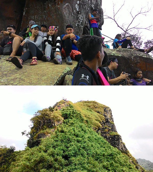 The queue to the monolith; Looking back at the summit
