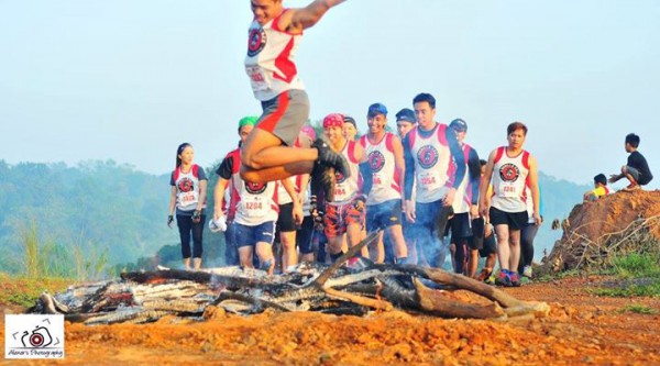 Fabulously jumping over the fire obstacle