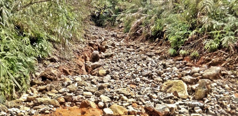 The rocks came from the river and were brought to the trail to allow trucks to pass