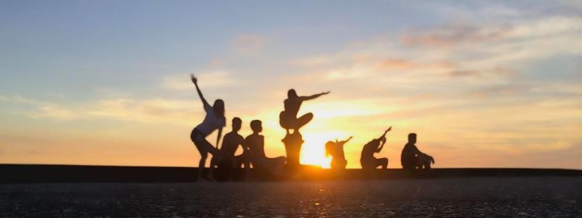 The group playing with silhouettes as the sun set