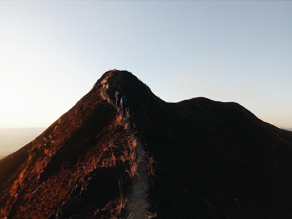 Walking up and down ridges as the sun sets